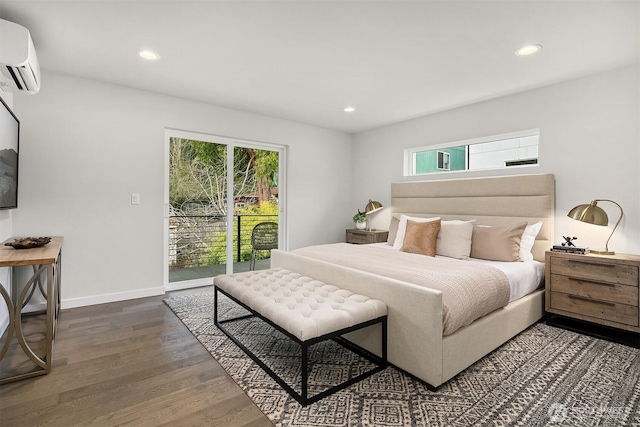 bedroom with multiple windows, dark wood-type flooring, access to exterior, and a wall unit AC