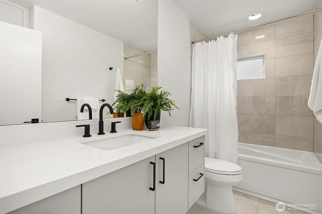 bathroom featuring vanity, shower / bath combination with curtain, toilet, and tile patterned floors