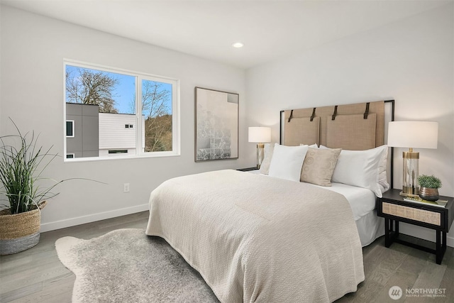 bedroom featuring recessed lighting, dark wood-style floors, and baseboards