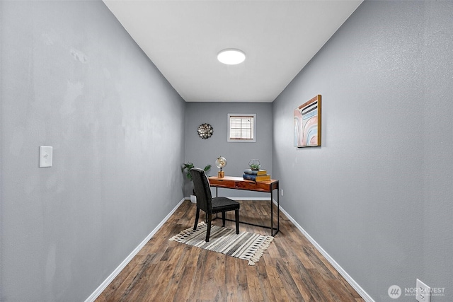 office space featuring wood finished floors and baseboards