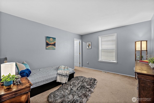 bedroom with visible vents, carpet floors, and baseboards