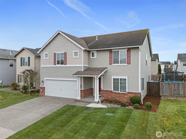 traditional-style house with brick siding, an attached garage, concrete driveway, and a front yard