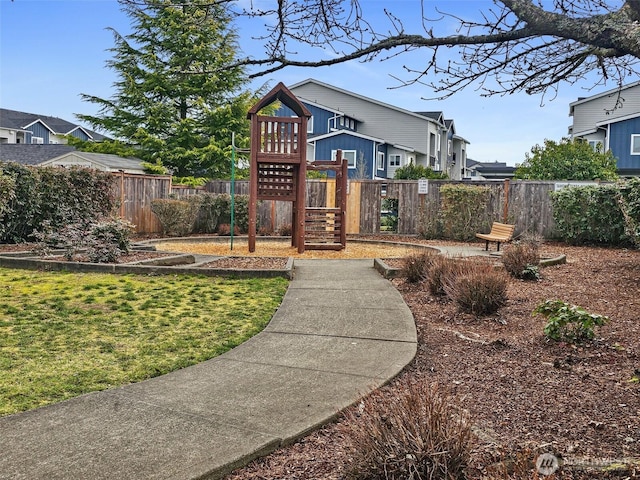 exterior space with a yard and fence