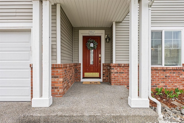 entrance to property with brick siding