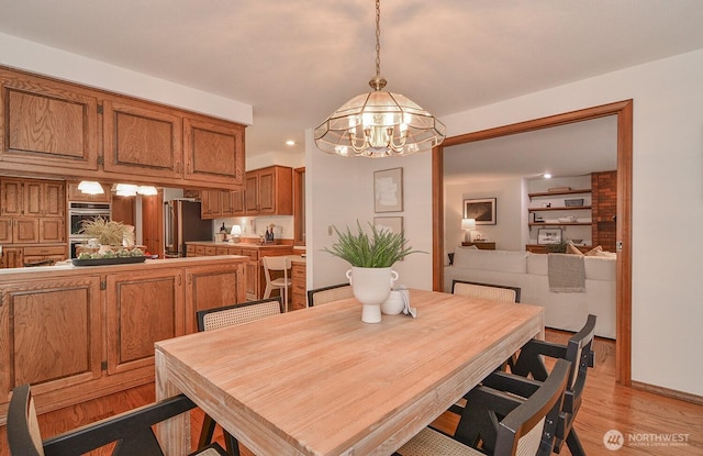 dining room with light wood-style flooring