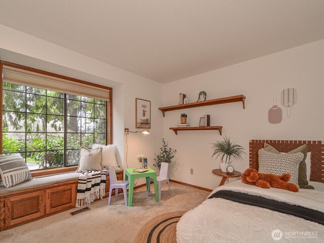 bedroom with visible vents, light colored carpet, and baseboards