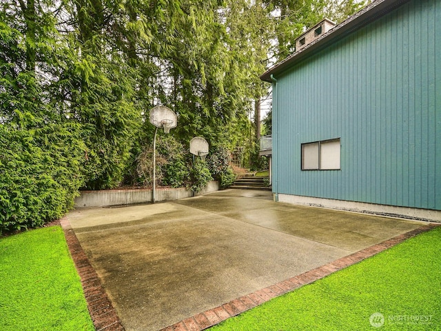 exterior space featuring basketball hoop