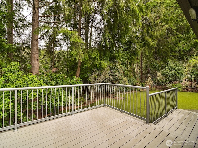 wooden deck with a yard