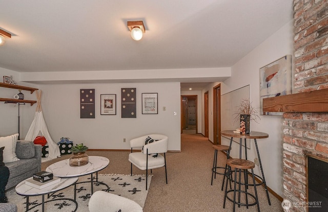 carpeted living area featuring a large fireplace