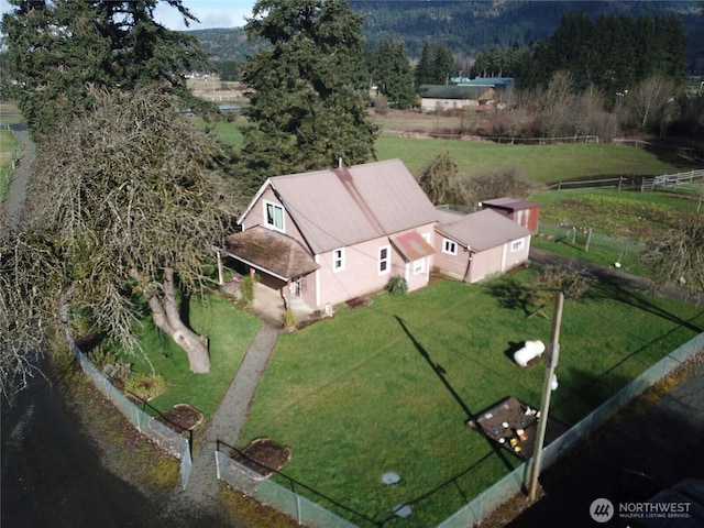 birds eye view of property with a rural view