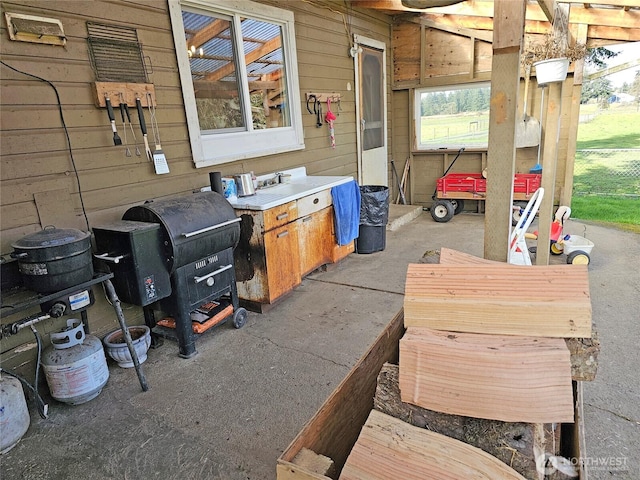 view of patio featuring a grill