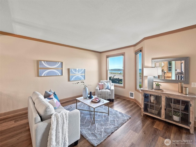 living room with crown molding, dark wood-style floors, visible vents, and baseboards