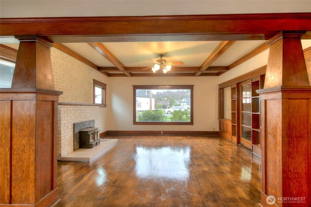 unfurnished living room with beam ceiling, ceiling fan, baseboards, and hardwood / wood-style floors