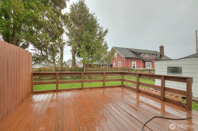 deck with a fenced backyard