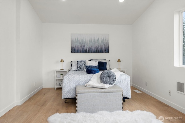 bedroom featuring recessed lighting, visible vents, baseboards, and wood finished floors