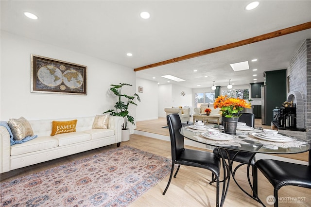 dining area with light wood-style flooring and recessed lighting