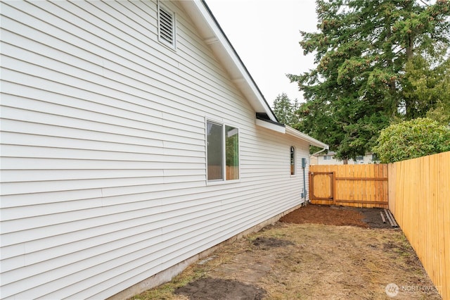 view of property exterior with fence