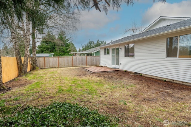 view of yard with a fenced backyard