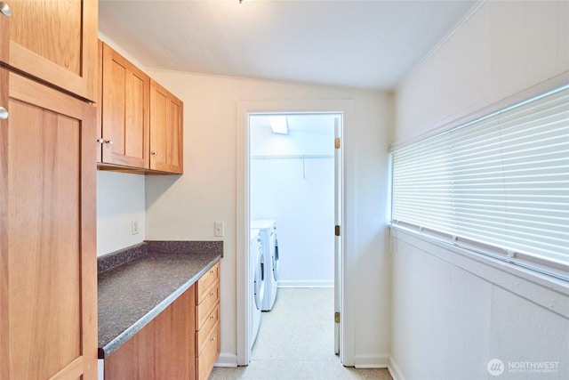 clothes washing area featuring laundry area and washer and dryer