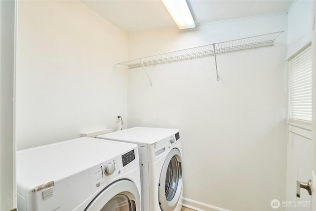 laundry area with separate washer and dryer and laundry area