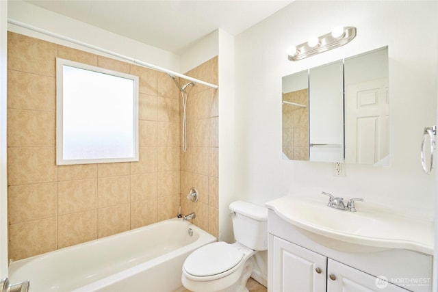 bathroom featuring vanity,  shower combination, and toilet