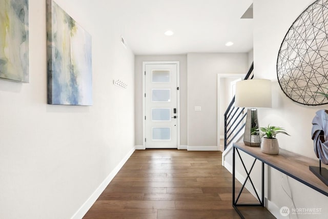 interior space with visible vents, dark wood-type flooring, baseboards, stairs, and recessed lighting