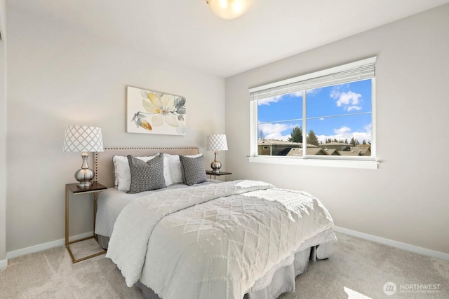 carpeted bedroom featuring baseboards