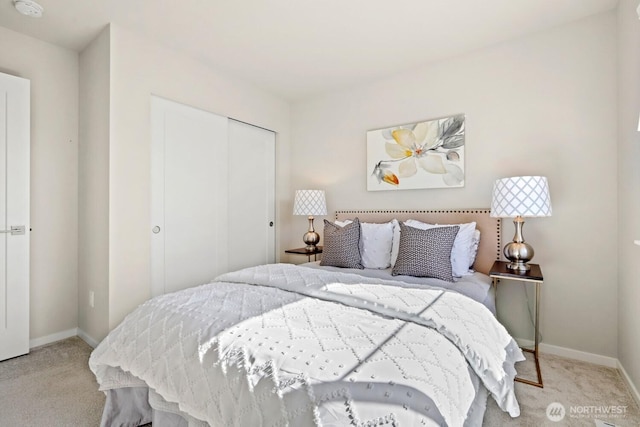 bedroom featuring baseboards, a closet, and carpet floors