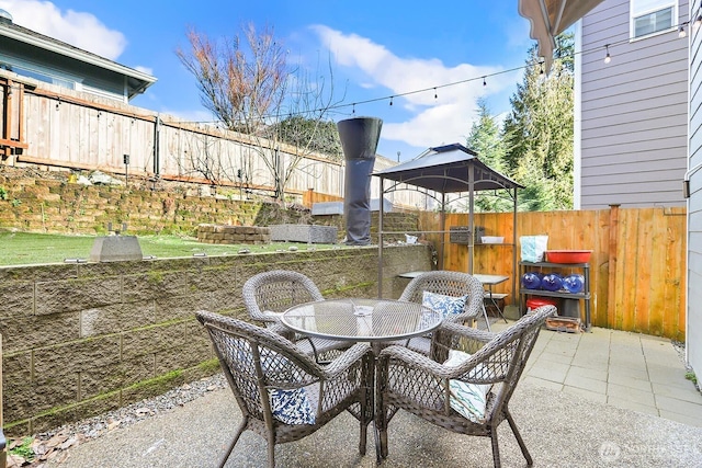 view of patio / terrace with outdoor dining area and a fenced backyard