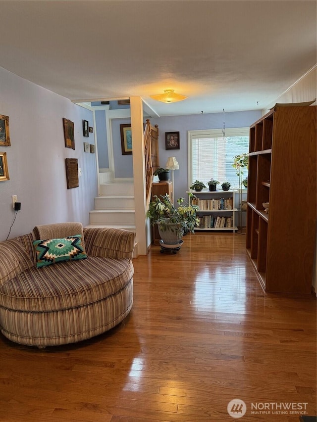 living room featuring stairway and wood finished floors