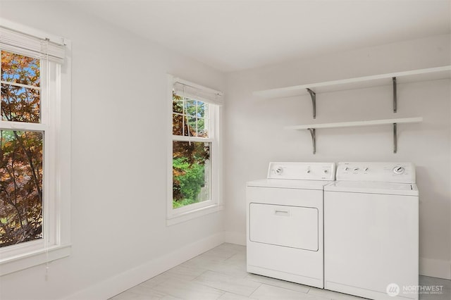 laundry room with washer and dryer, laundry area, and baseboards