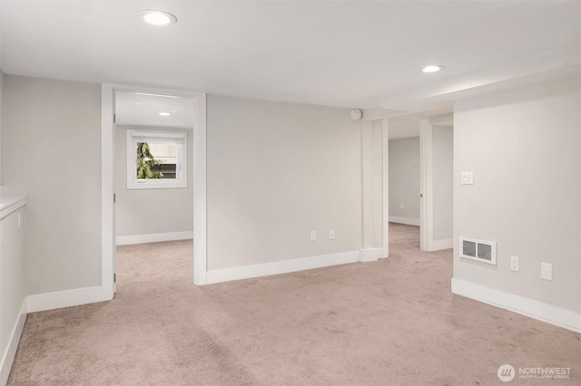 empty room with visible vents, recessed lighting, baseboards, and carpet floors