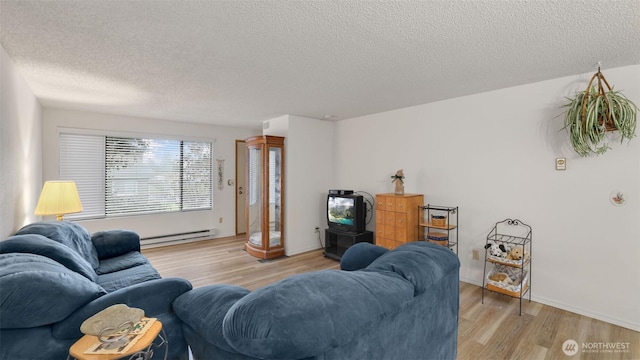 living area with baseboards, a textured ceiling, light wood-style floors, and a baseboard radiator