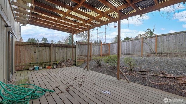 wooden deck with a fenced backyard and a pergola