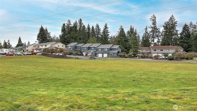 view of front of home featuring a residential view and a front lawn