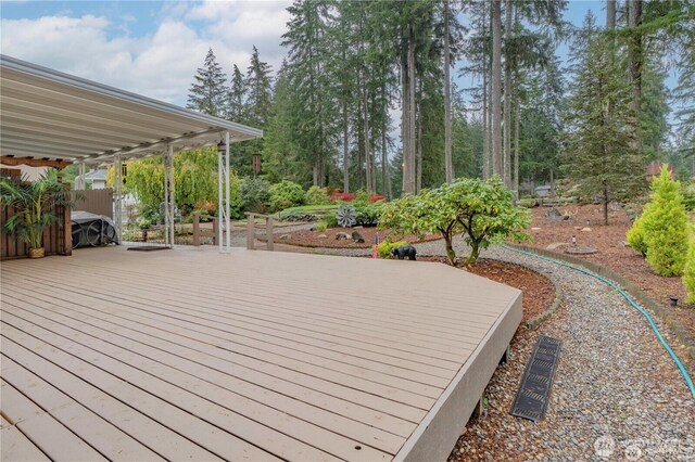 wooden deck featuring fence