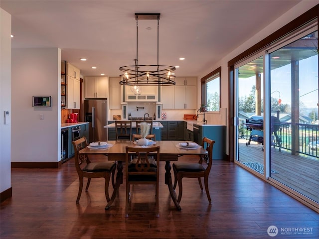 dining room featuring recessed lighting, baseboards, and dark wood-style floors