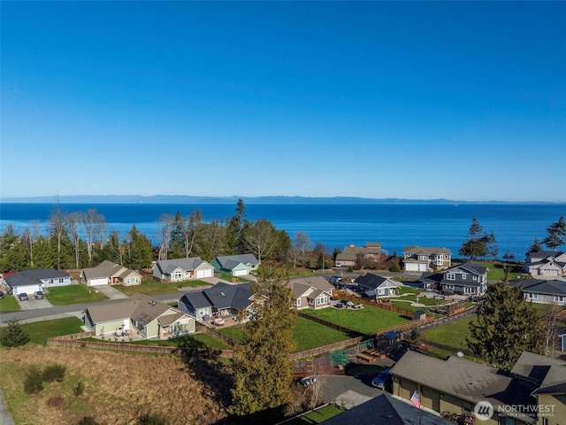 birds eye view of property featuring a residential view and a water view