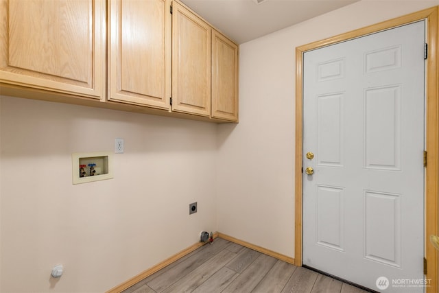 washroom with light wood-type flooring, cabinet space, baseboards, hookup for an electric dryer, and hookup for a washing machine