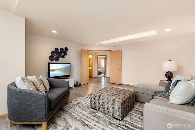 living room with recessed lighting and light wood finished floors