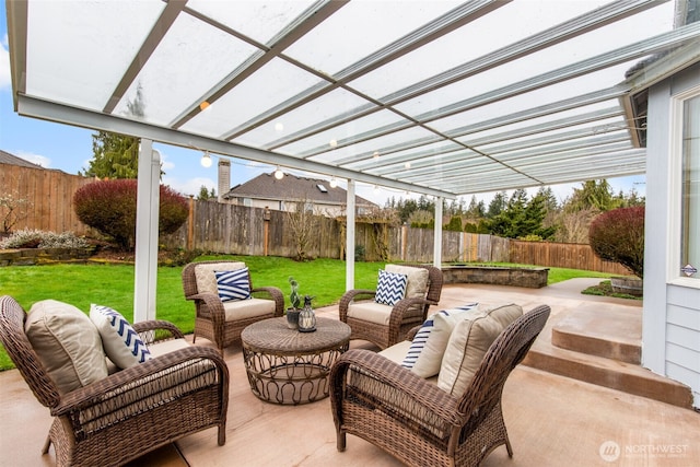 view of patio with outdoor lounge area and a fenced backyard