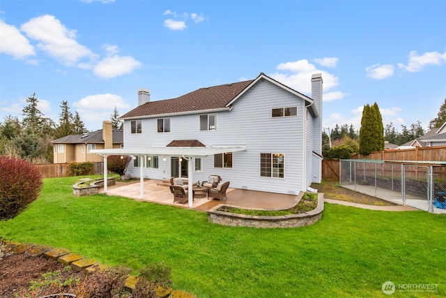 rear view of house featuring an outdoor living space, a yard, a fenced backyard, a chimney, and a patio area