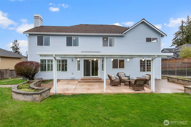 rear view of house with an outdoor living space, a lawn, fence, and a chimney