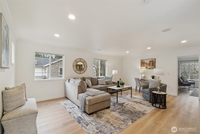 living room with recessed lighting, baseboards, light wood finished floors, and ornamental molding