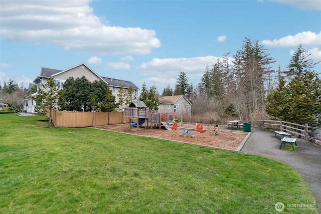 view of yard with a playground and fence