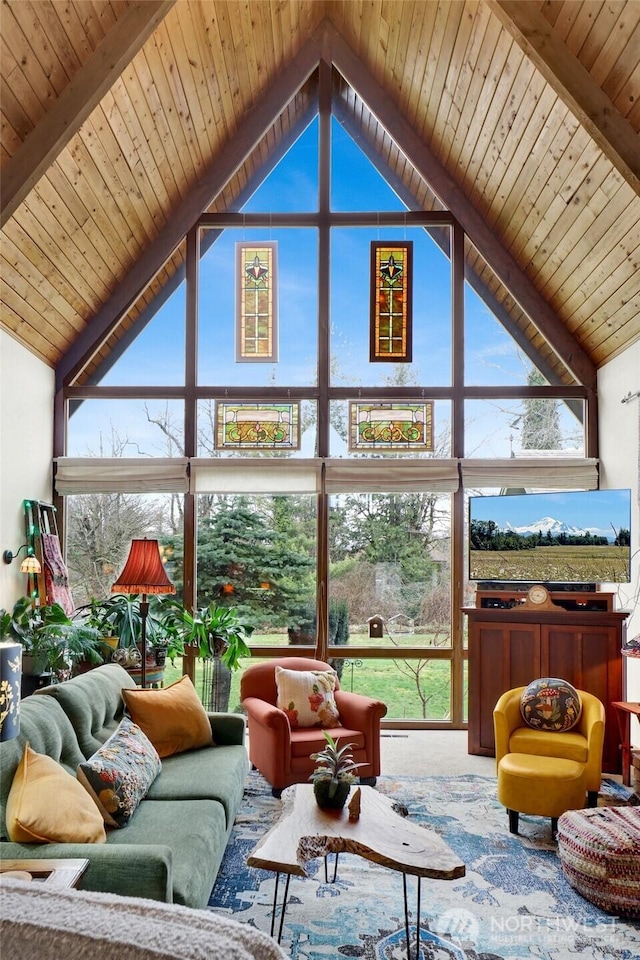 sunroom / solarium featuring wood ceiling and lofted ceiling with beams