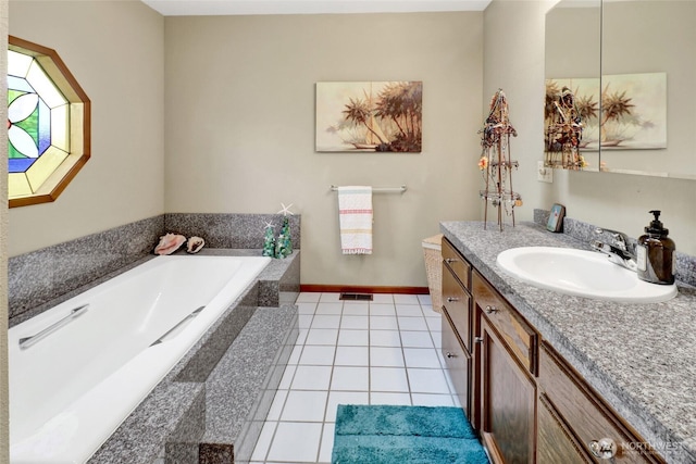 full bath with visible vents, tile patterned flooring, baseboards, a bath, and vanity