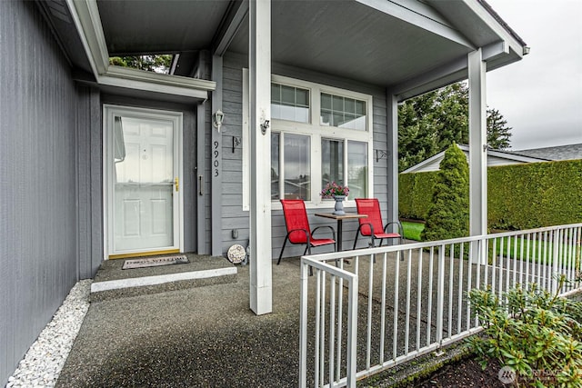 property entrance featuring a porch