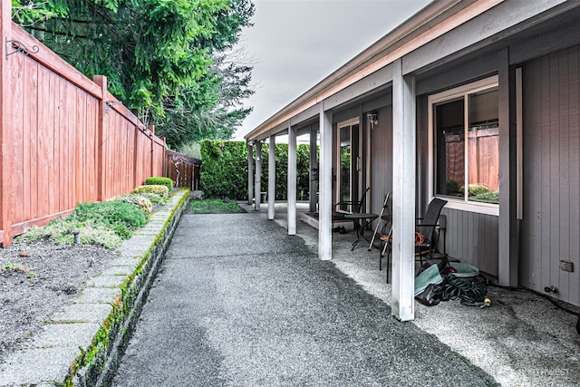 view of patio / terrace featuring fence