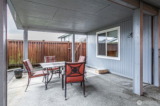 view of patio / terrace with outdoor dining area and fence